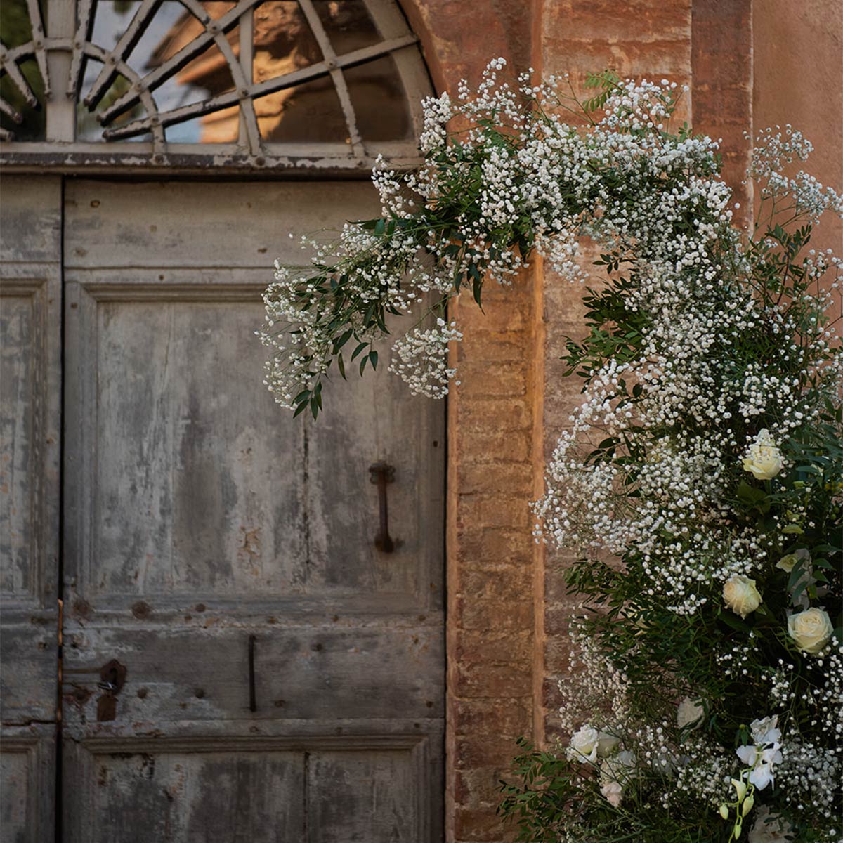 Floral decoration at the entrance of Villa Donati, in Montestigliano, during Farzana & Luke Tuscan wedding